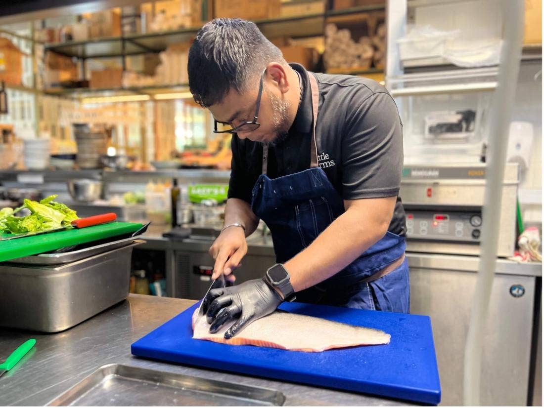 Head Chef Rizan cutting up salmon